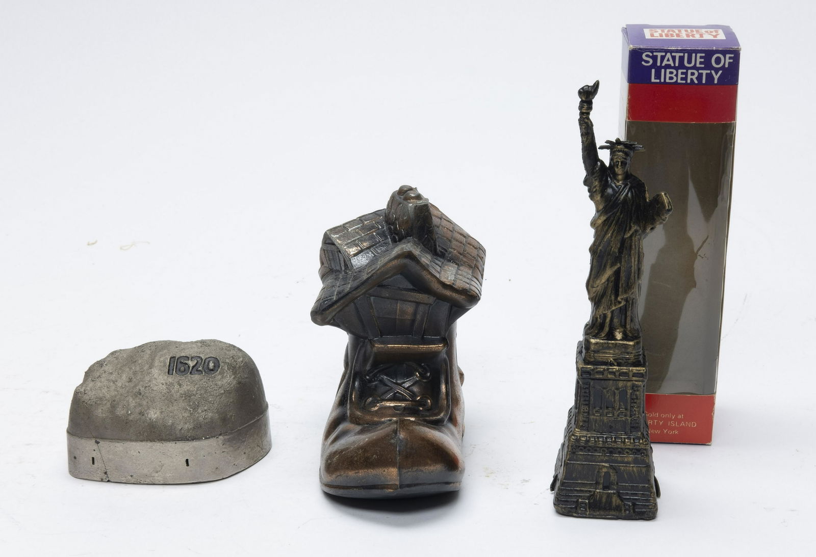 Three Still Banks Statue of Liberty: Includes: Boxed Statue of Liberty, Plymouth Rock and Old Woman in the Shoe Bank. Various Materials. Fine to Pristine Condition