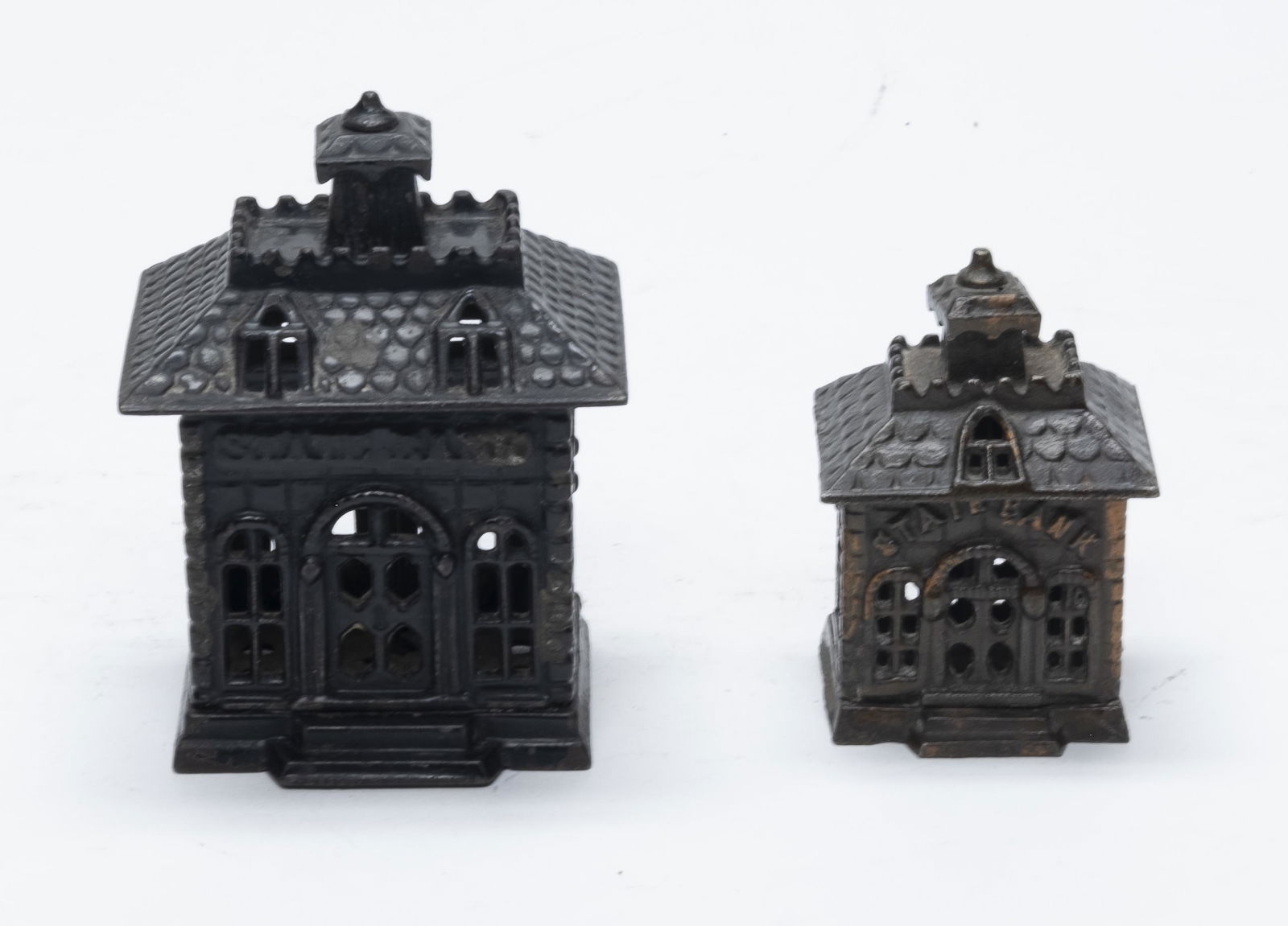 Two State Cast Iron Banks: Made by Kyser & Rex. Made of Cast Iron. 3 1/8" - 4 1/4" Tall. Very Fine Condition.