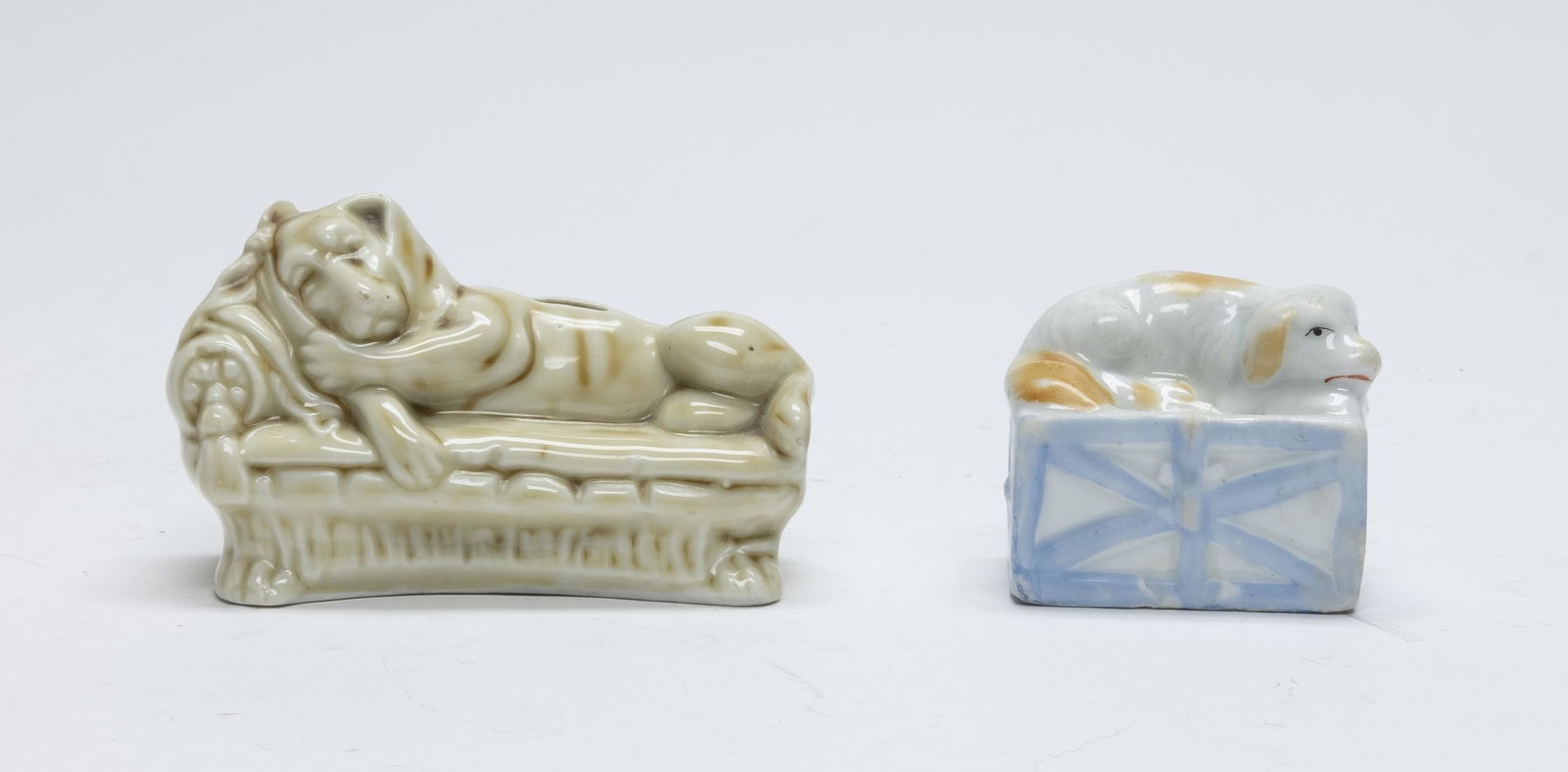 Two Ceramic Lounging Dog Still Banks (1 of 4)