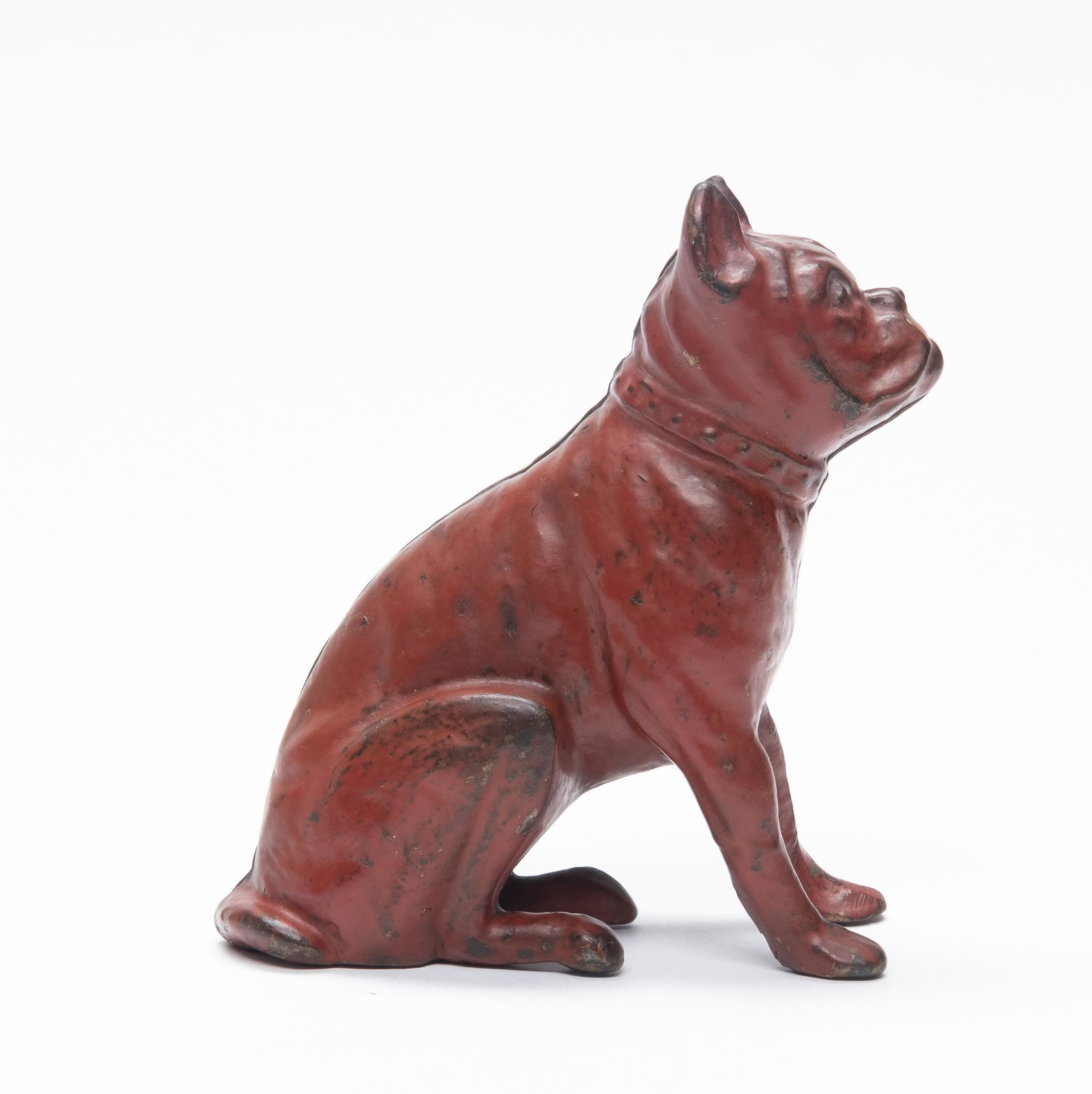 Red Boxer Dog Cast Iron Still Bank: Made by A. C. Williams. The bank is scarce in red paint. 4 1/8" Tall. Made of Cast Iron. Excellent Condition.