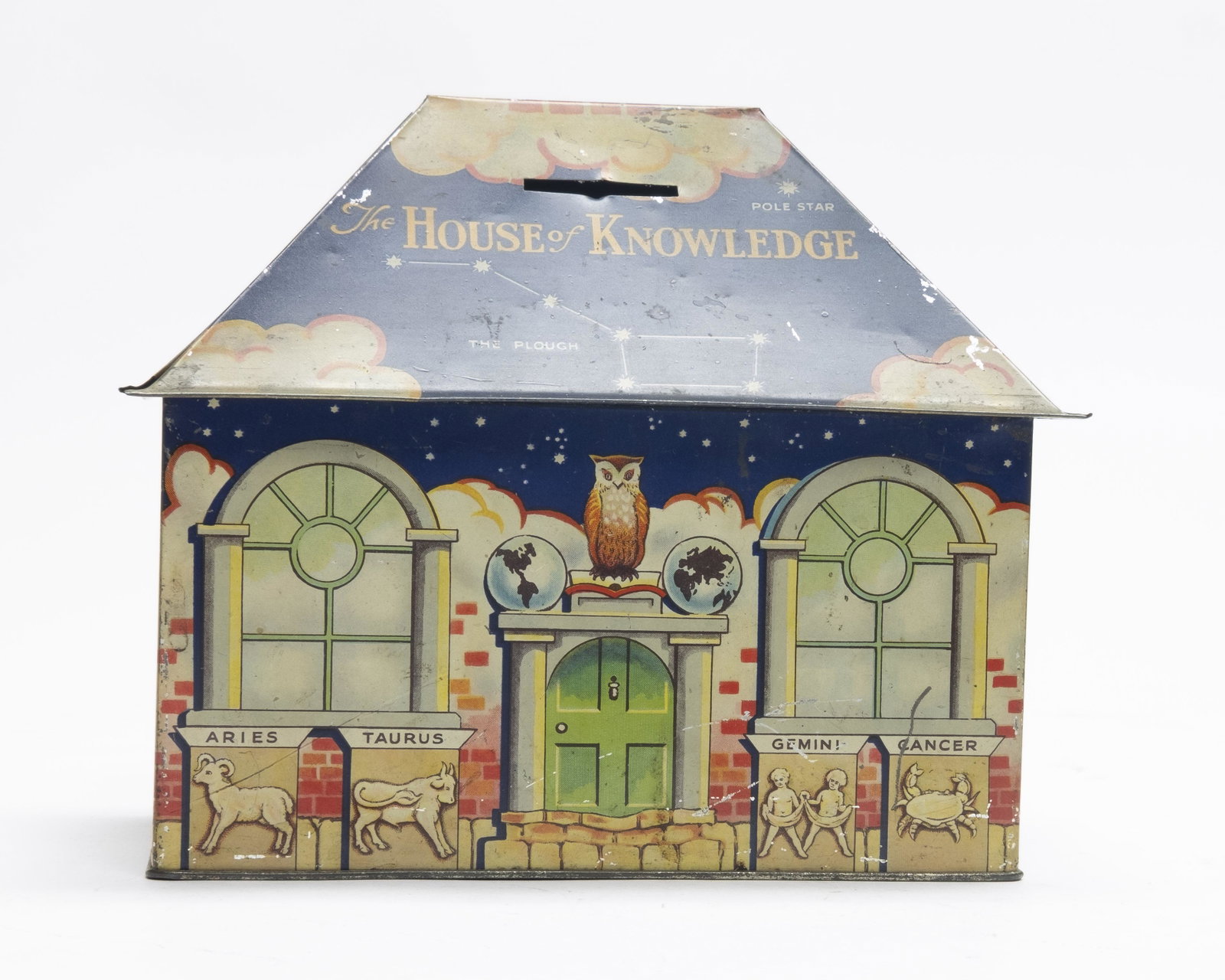 House of Knowledge Tin Bank: William Crawford & Sons of England. Academic imagery, including a celestial map of the constellations, decorate the roof and walls of the “House of Knowledge”. 8” wide. Excellent Condition.