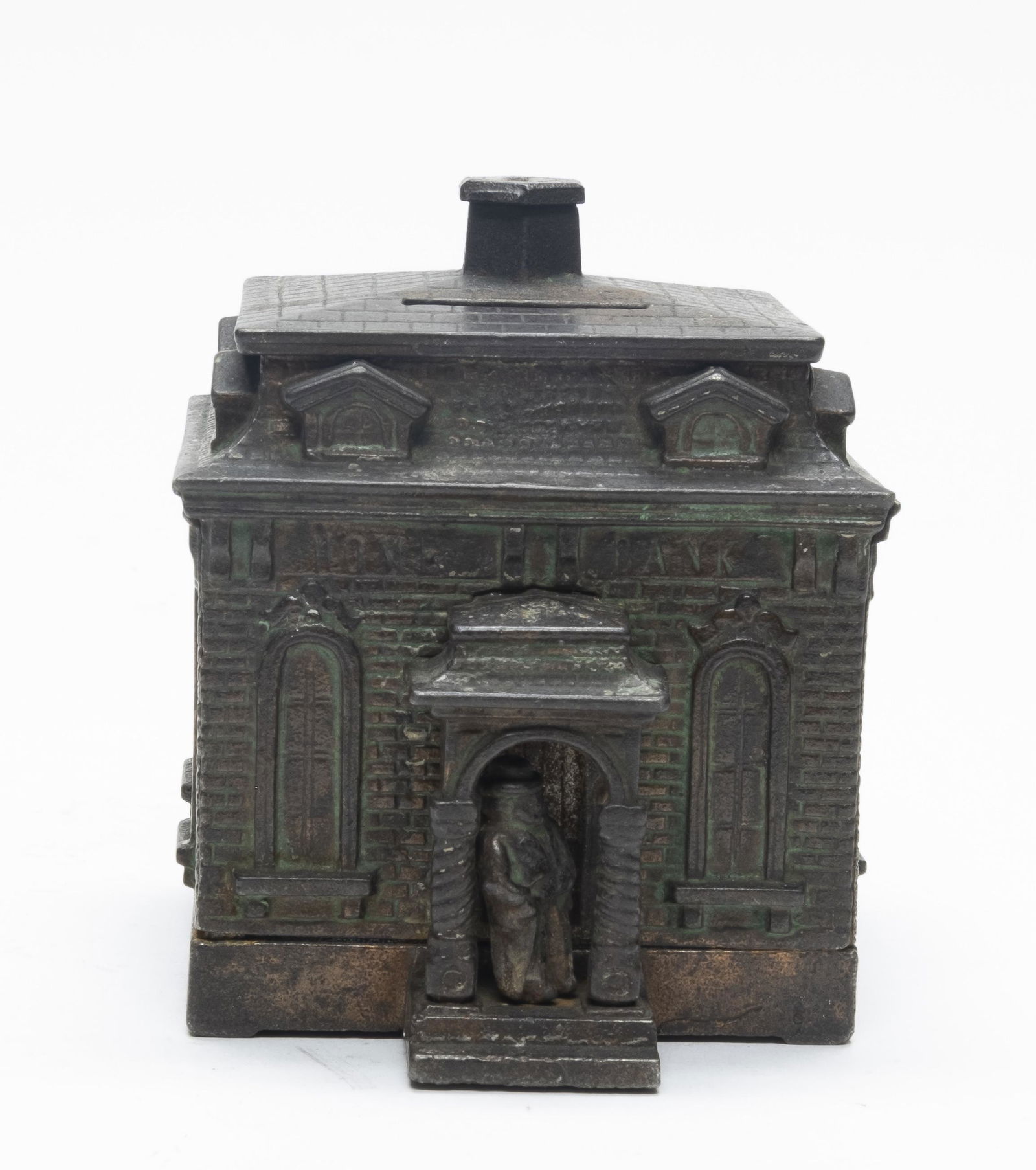 Judd Home Cast Iron Still Bank: Made by H. L. Judd. This bank has a nice green wash on the side panels. 4 1/2" Tall. Made of Cast Iron. Very Good Condition.