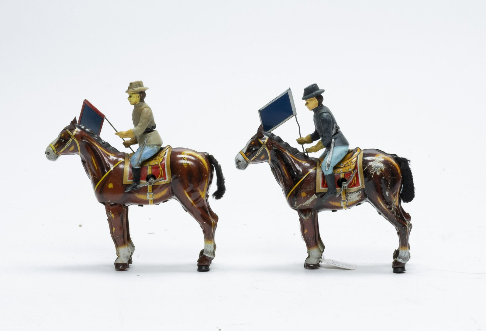 Confederate & Union Cavalry Windup Toys Japan: Made in Japan. Made of Tin. 5" Long. The toys work. Very Fine to Excellent Condition.