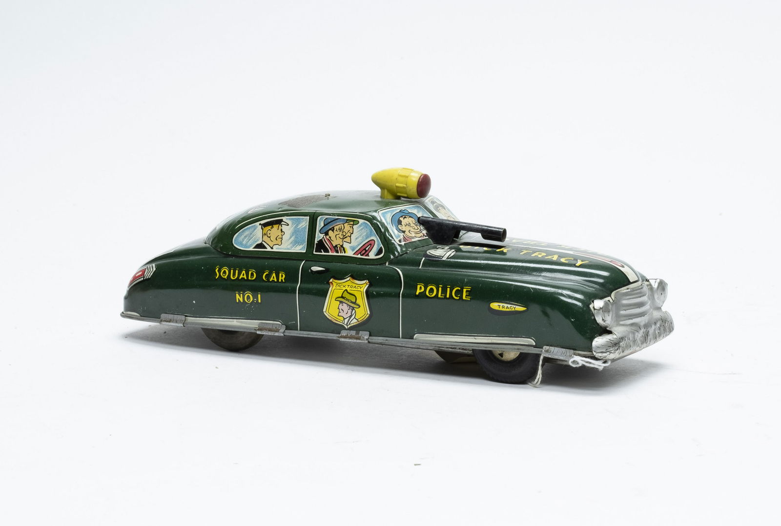 Marx Dick Tracy Squad Car with Mount Gun: Made by Marx. Made of Tin. 11" Long. The toy works. Fine Condition. Tape stain on roof.