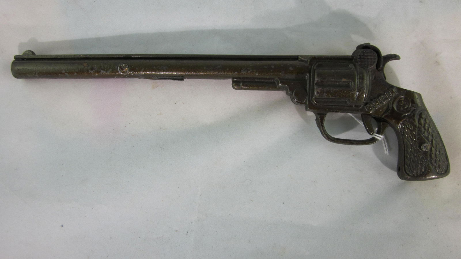 Kenton Single Shot "Sheik" Long Barrel Cap Gun.: Very rare long barrel cap gun, 10 1/4" long, bronze finish, circa 1920. 1 piece, condition very good, No box.