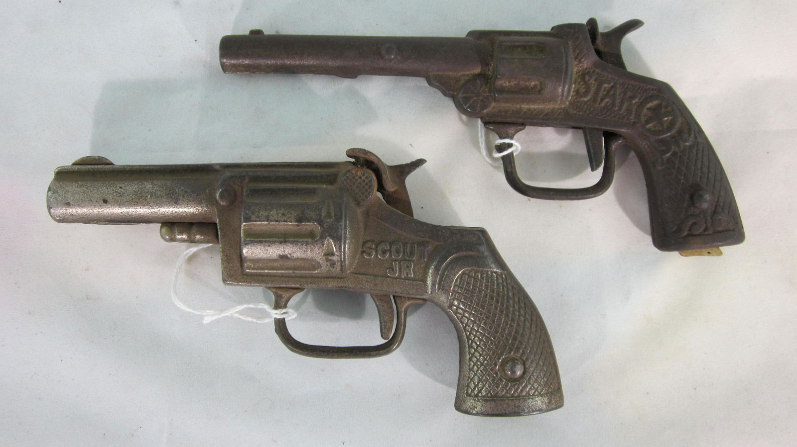 Stevens "Star" & "Scout Jr" Cap Guns.: Stevens single shot cap guns. "Star" pistol is 6 1/4" long circa 1910, "Scout Jr" is 6 " long circa 1930. 2 pieces, condition very good. No boxes.