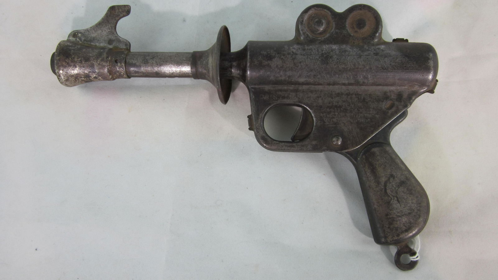 Daisy Buck Rogers 25th Century Ray Gun.: Daisy Mfg Co. Buck Rogers 25th Century Toy Ray Gun, 9 1/2" long, circa 1936. Complete, trigger mechanism cocks & fires. 1 piece. Condition very good, a few small rust marks. No box. Very rare.