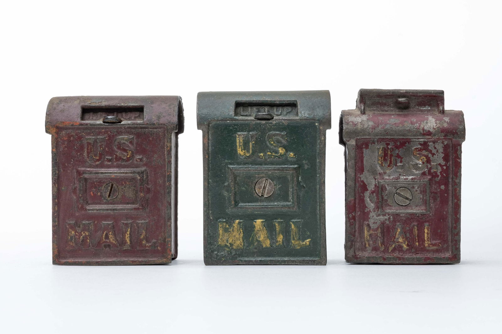 Three U. S. Mail Iron Banks: Made of Cast Iron. 3 1/2" Tall. Fair to Fine Condition.