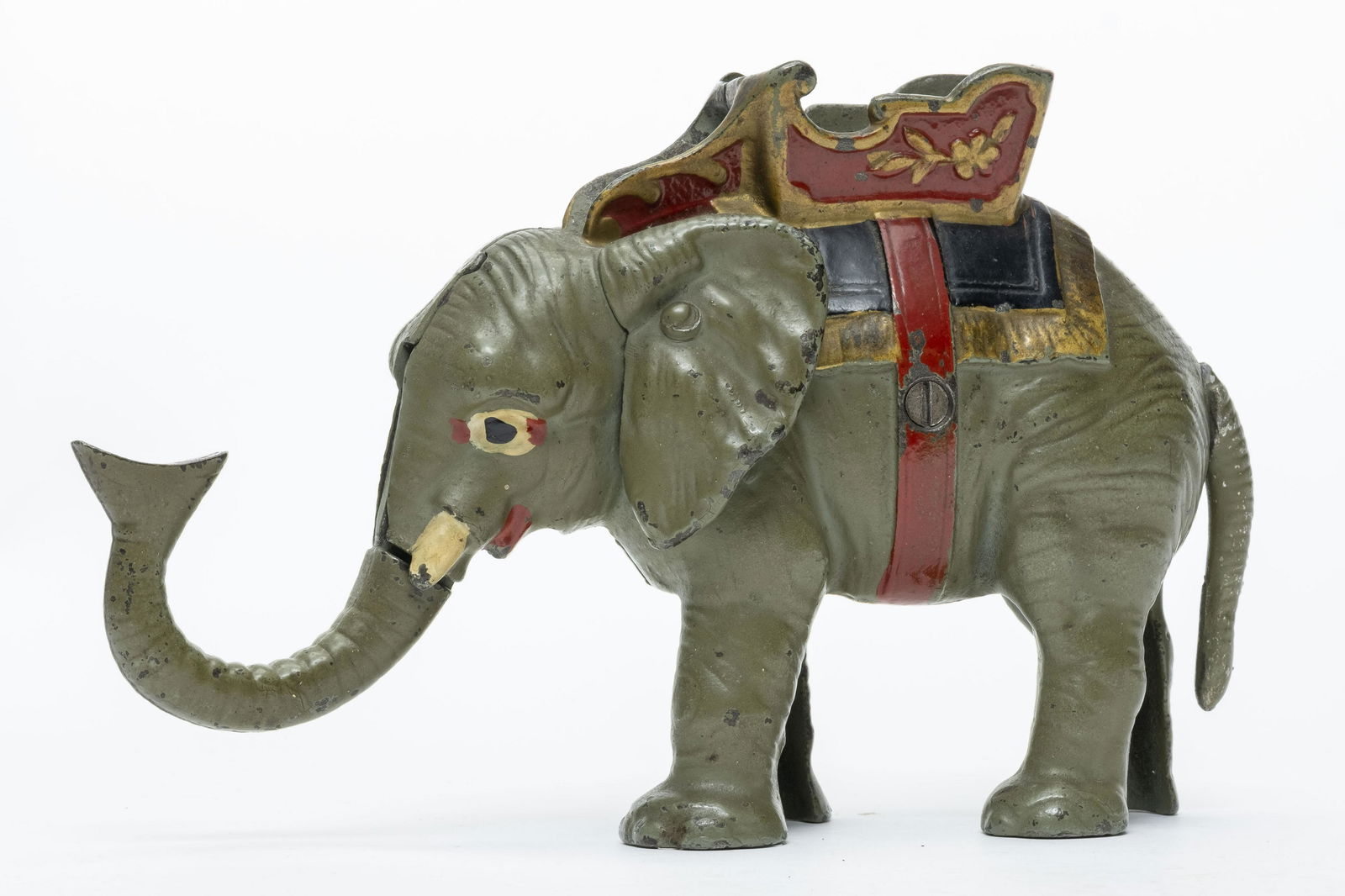 Hubley Elephant Iron Mechanical Bank: Made by Hubley. Made of Cast Iron. Worked when tested. The more scarce version with grey elephant. Provenance: Tom Sage Sr. Collection. Excellent Condition.