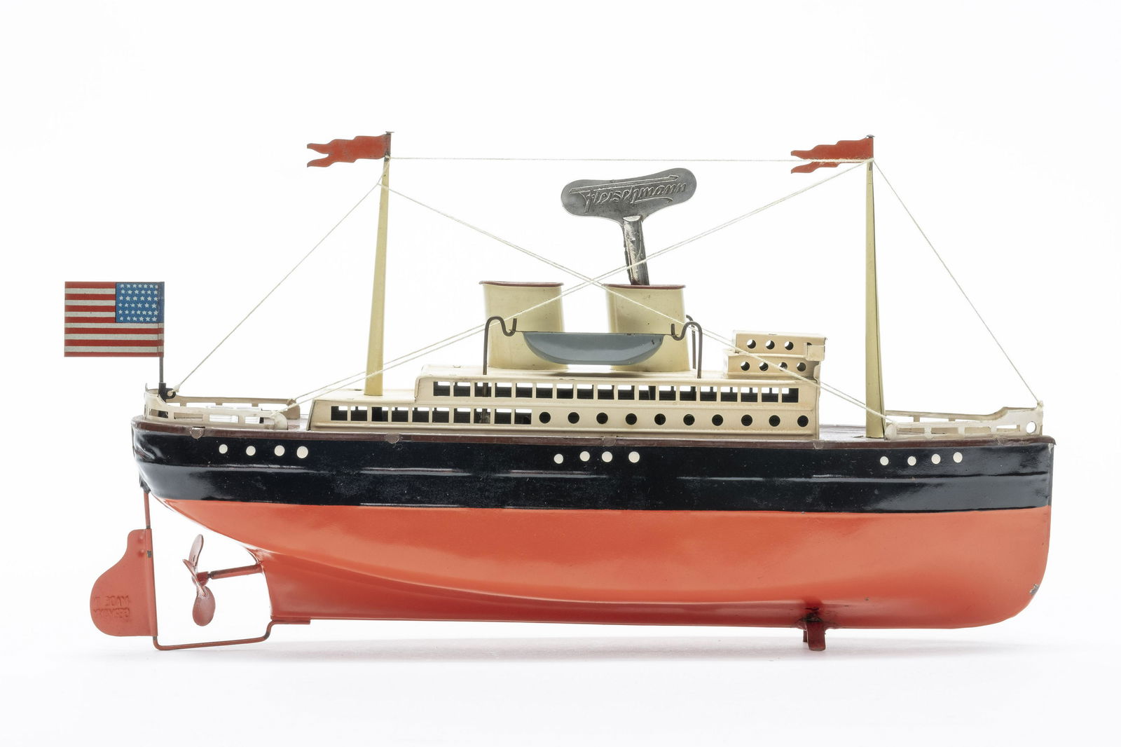 Fleischman Ocean Liner: Made by Fleischman. 12 1/2" Long. Made of Tin. Excellent Condition. Retains original key.