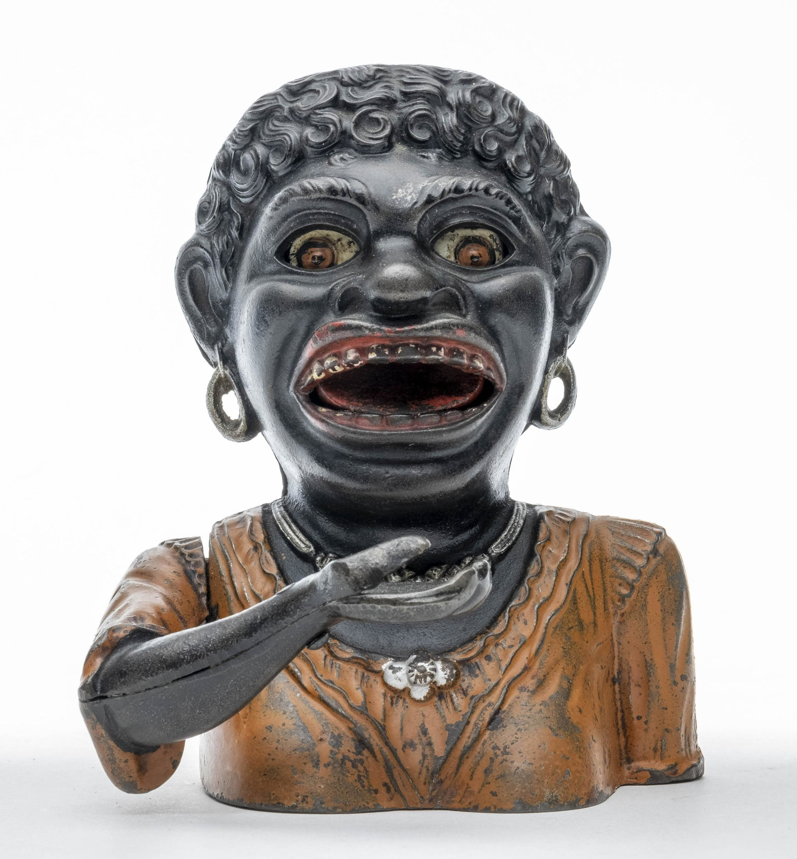 Dinah Iron Mechanical Bank Rare: John Harper Ltd. 1910's. Made of Cast Iron. Classic coin swallowing bank. Scarce with an orange shirt. Worked when tested. Fine Condition.