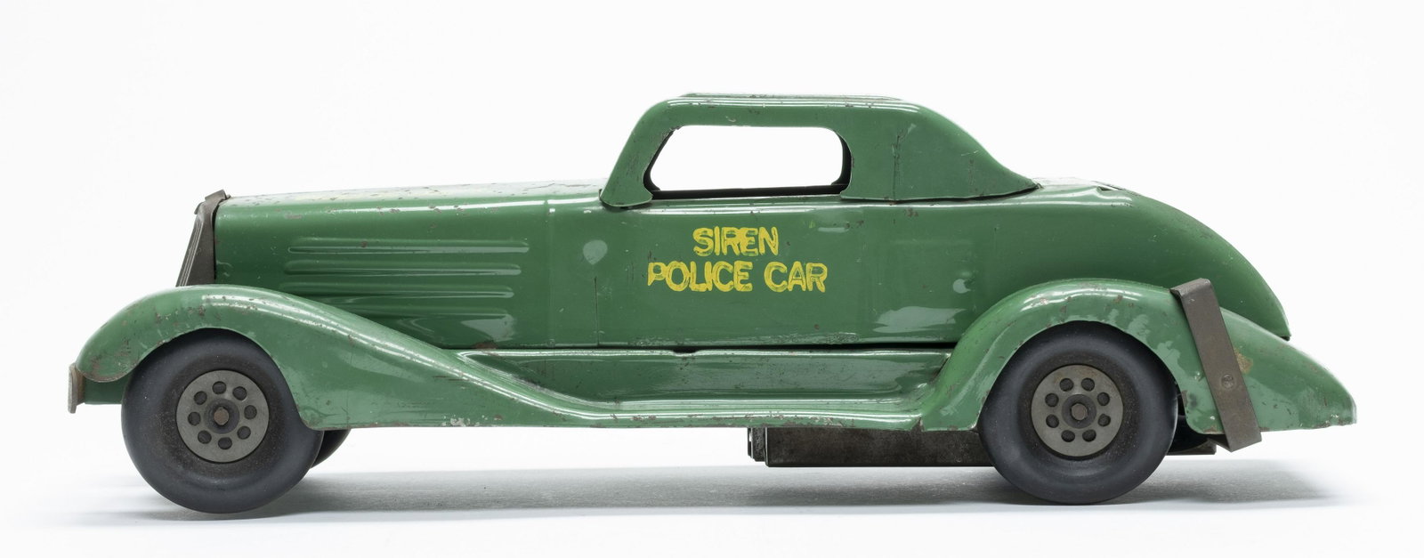 Marx Siren Police Car Windup Toy: Made by Marx. This car emits a "Siren" sound when it runs. 14" Long. Made of Pressed Steel. Worked when tested. Very Fine Condition.