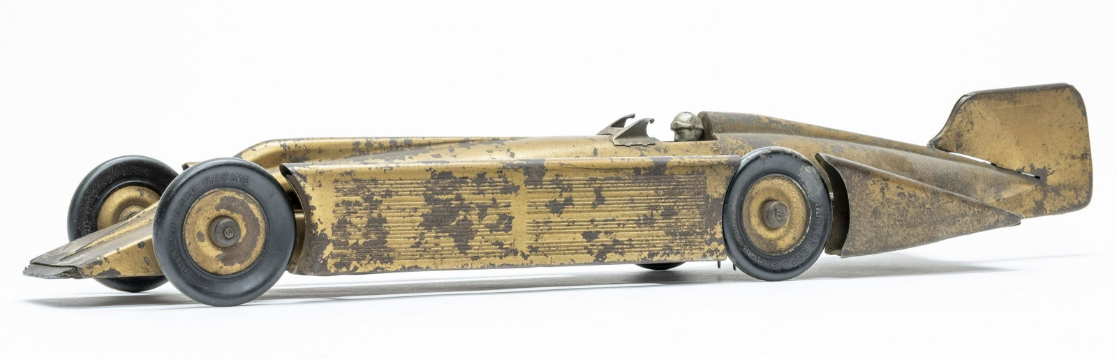 Kingsbury Golden Arrow Race Car: Made by Kingsbury 1930's. Made of Tin. 19 1/2" Long. Worked when tested. Good Condition. Missing windscreen. One tire with a split. Some surface rust.