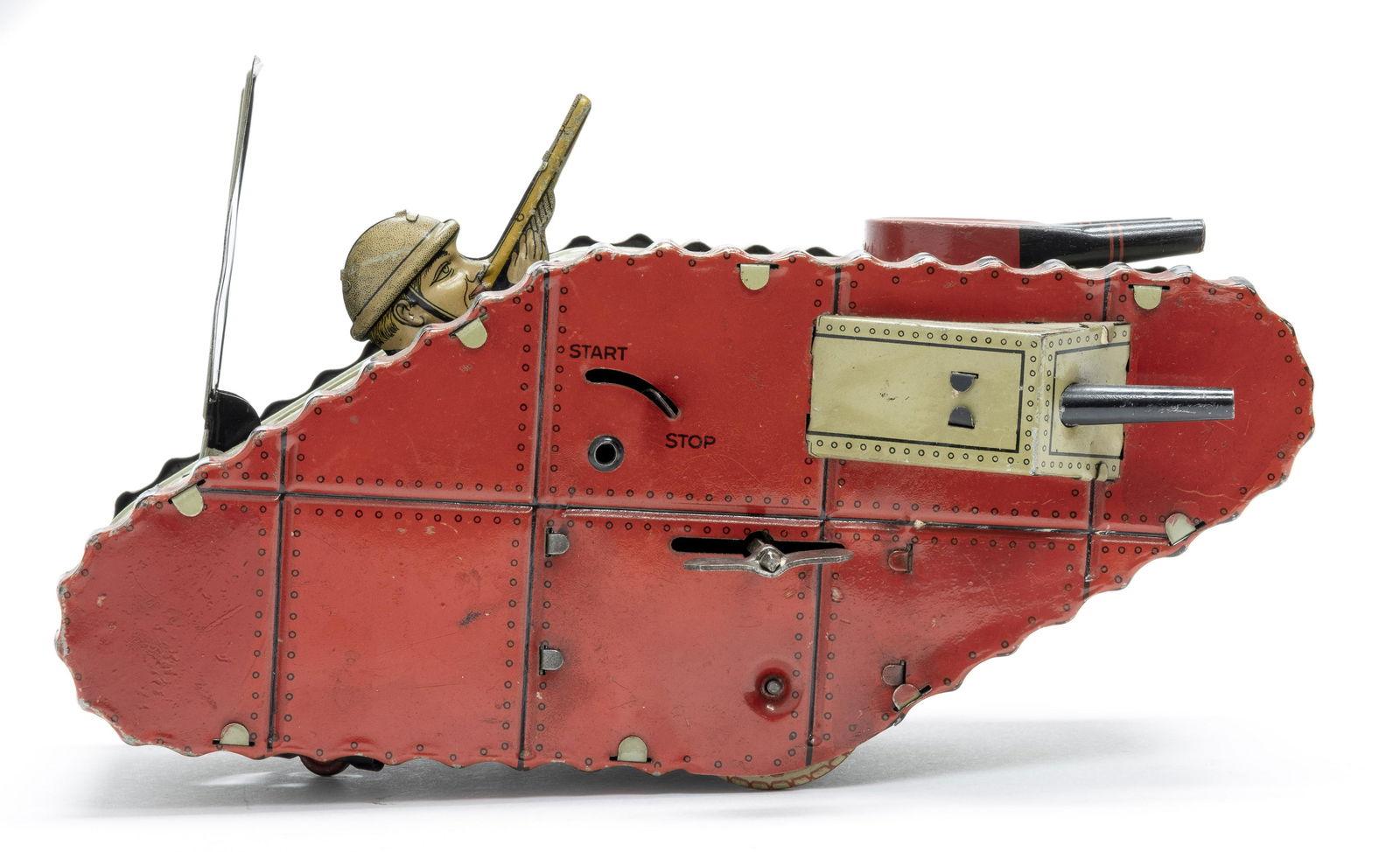 German Tin Windup Tank w/ Soldier: Marked "Made in Germany" 1930's on the rear. Made of Tin. 9 1/2" Long. Worked when tested. Fine Condition. One gun loose and two tabs missing from the gun box.