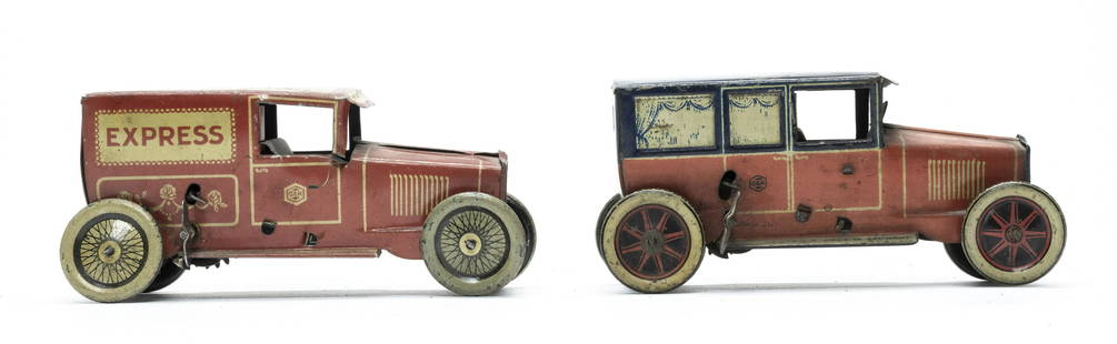 Two G&K Tin Windup Toys: Made by Greppert & Kelch of Germany 1920's. Made of Tin. 5 1/2" Long. One works, Express does not work. Fine to Very Fine Condition. Express wagon with one loose wheel.