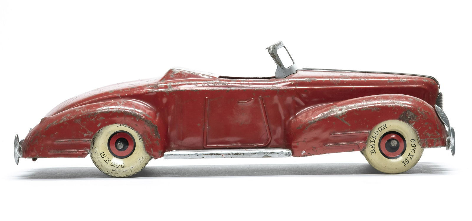 Wind Up Tin Red Coupe: Made in America 1930's. Made of Tin. 11" Long. Fair Condition.
