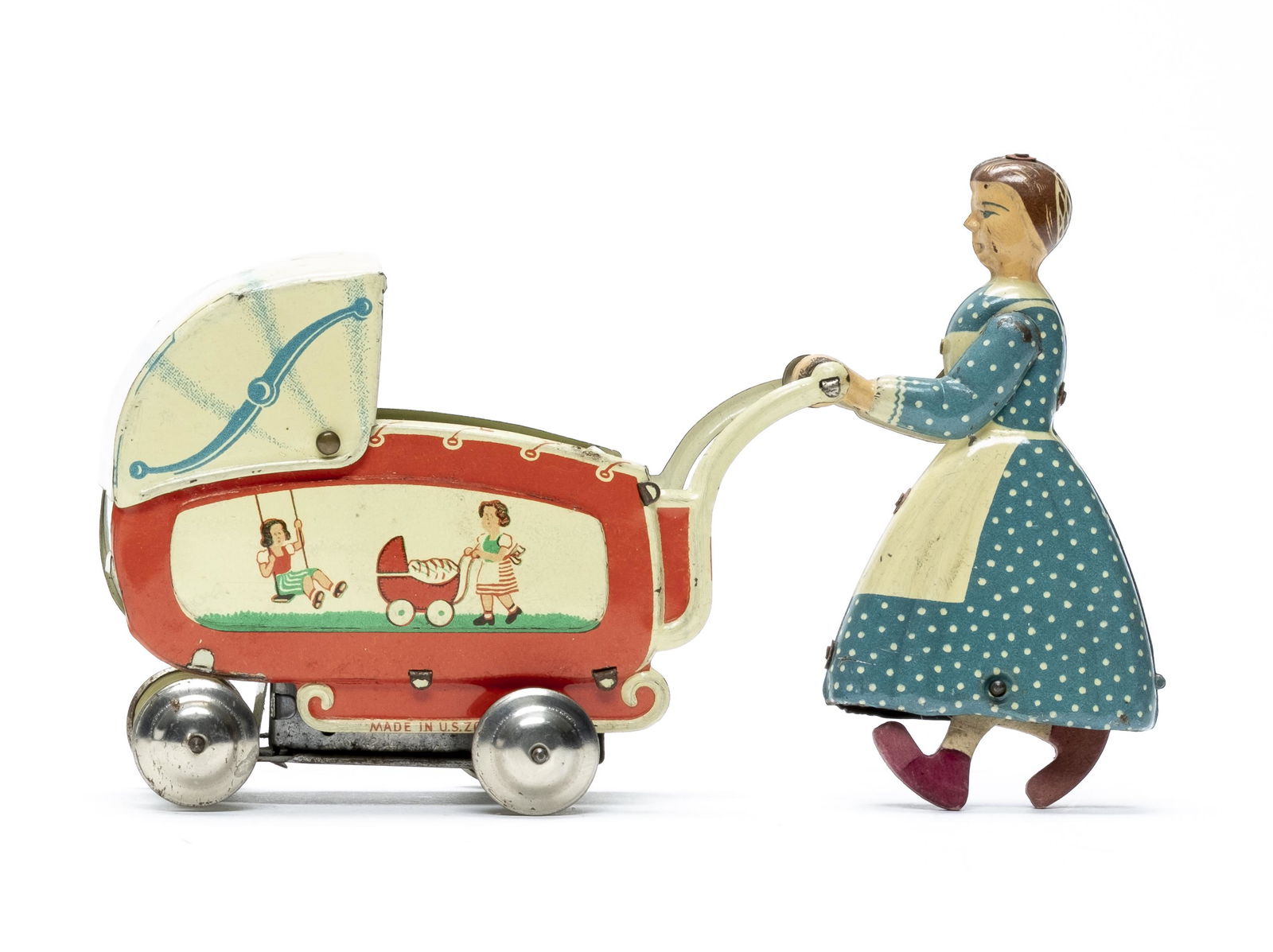 German Wind Up Woman Pushing Carriage: Marked "Patent Made in Germany U. S. Zone". Made of Tin and Cardboard (Woman's Legs). 6 1/4" Long. Worked when tested. Adjustable direction. Very Fine Condition. No Key.