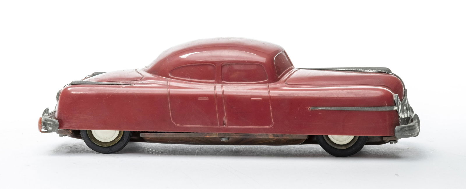 Belco "Royal' Sedan Wind Up: Made by Belco of Germany 1955. Made of Plastic. 9 3/4" Long. Worked when tested. Very Fine Condition. Sticker mark on hood. Bumpers have lost their luster. No key.