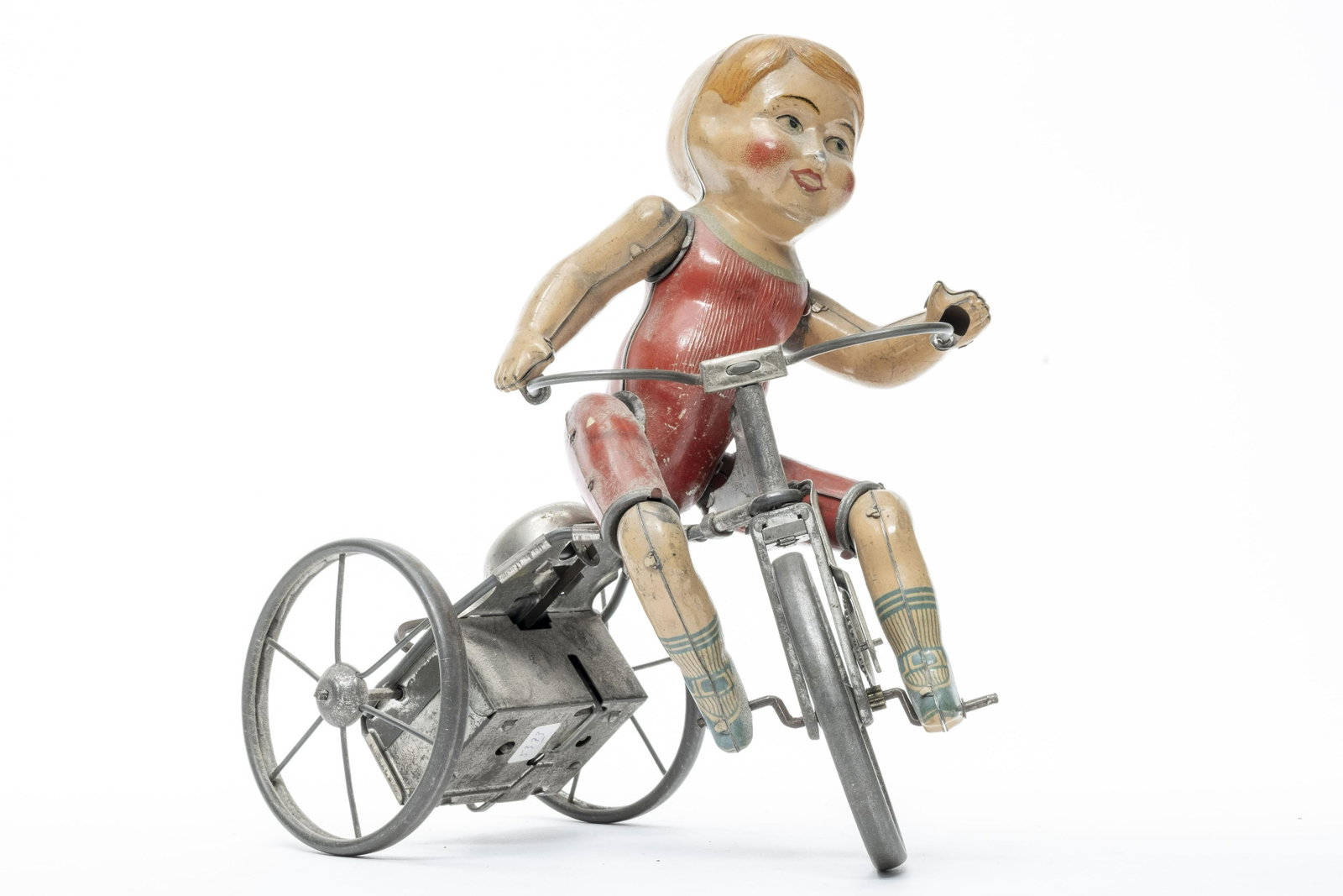 Linstrom Boy on Tricycle: Made by Linstrom of America - 1930's. This is the earlier, all tin version. Worked when tested. 9" Tall. Very Fine Condition.