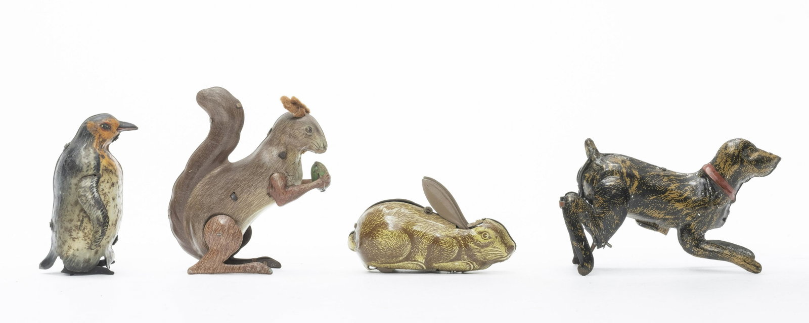 Dog, Penguin, Squirrel & Rabbit: German or U. S. Zone German - 1930's/40's. Made of Tin. 3" to 4" Tall. Worked when tested. Very Good to Excellent Condition. No Key.