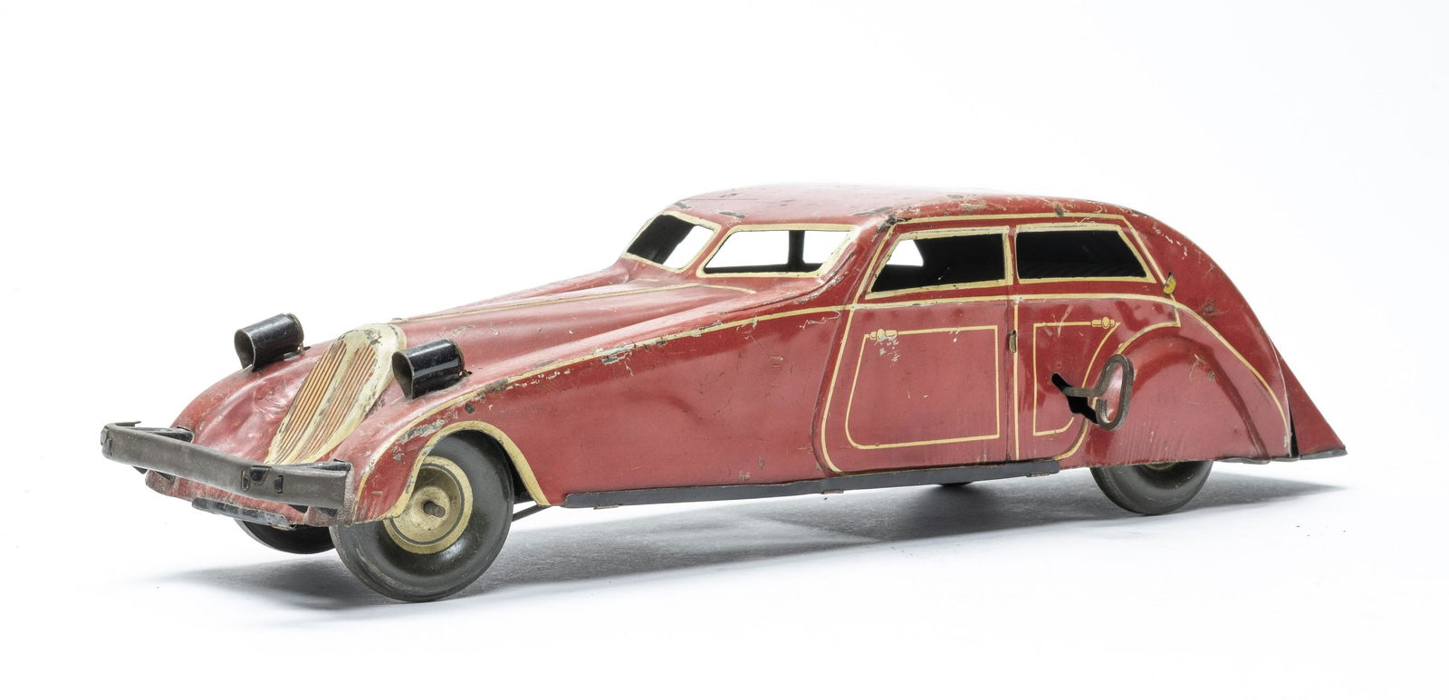 Art Deco Era Coupe: European 1935. 15" Long. Wind up worked when tested, battery operated lights did not. Good Condition. Scratches throughout and missing the battery cover.