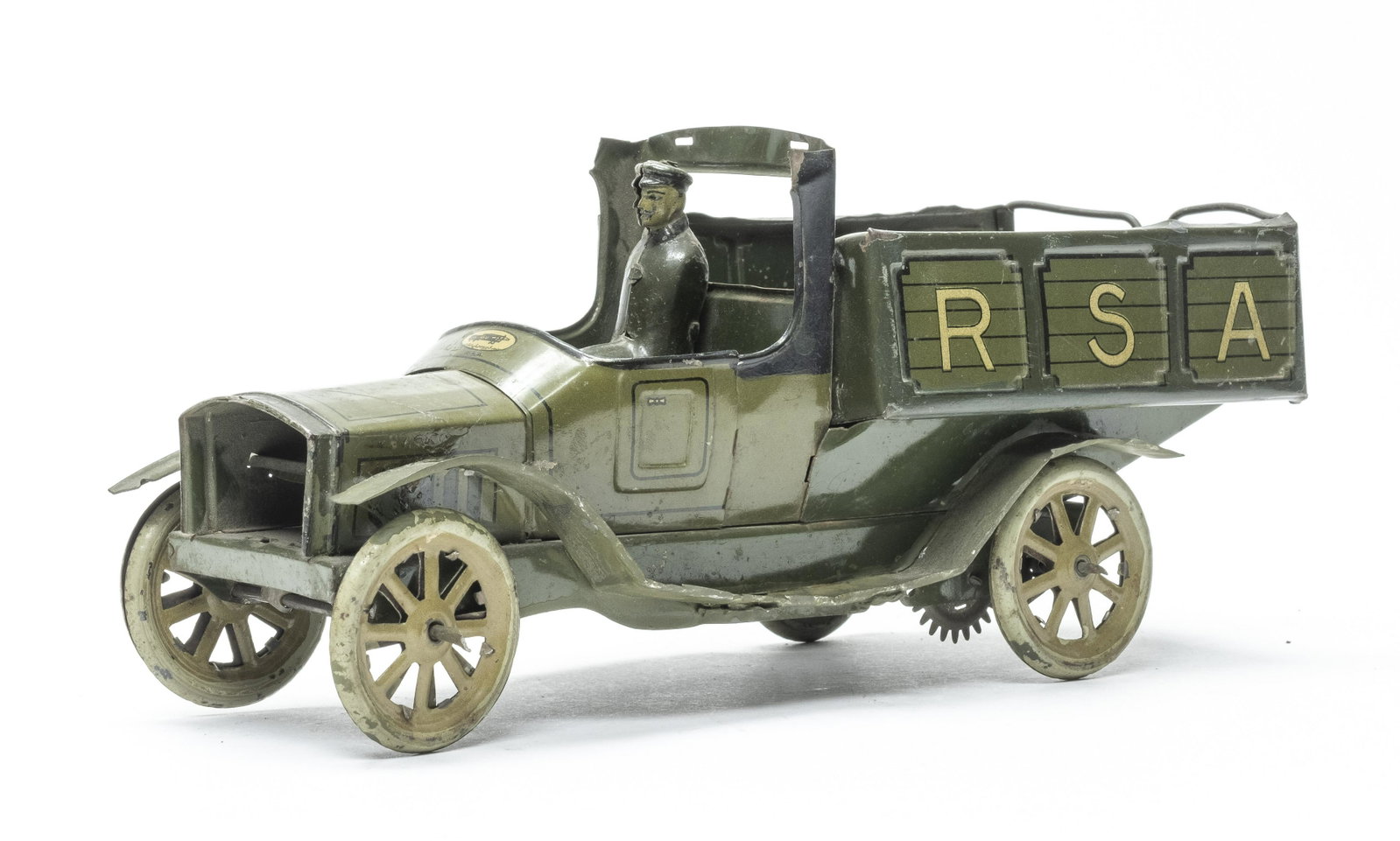 RSA Flatbed Truck: Made by RSA, Spanish 1920's. 9 3/4" Long. This is a very scarce commercial truck. Very Good Lithography. Missing the grill, rear gate and canopy over driver. One fender replaced and no mechanism.