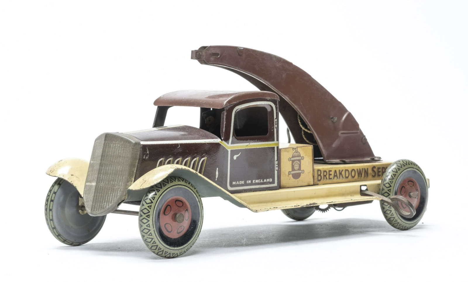 Wells Tow Truck: British 1930's. 9 1/2" Long. Did not work when tested. Fine Lithography. Missing the towing hook.