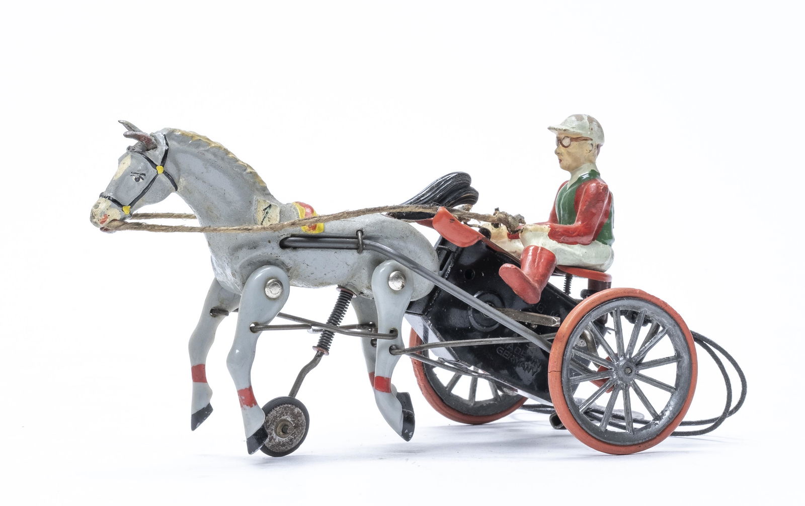 Sulky Toy: Western Germany 1955. 6 1/2" Long. Worked when tested. Excellent Condition. Retains a key.