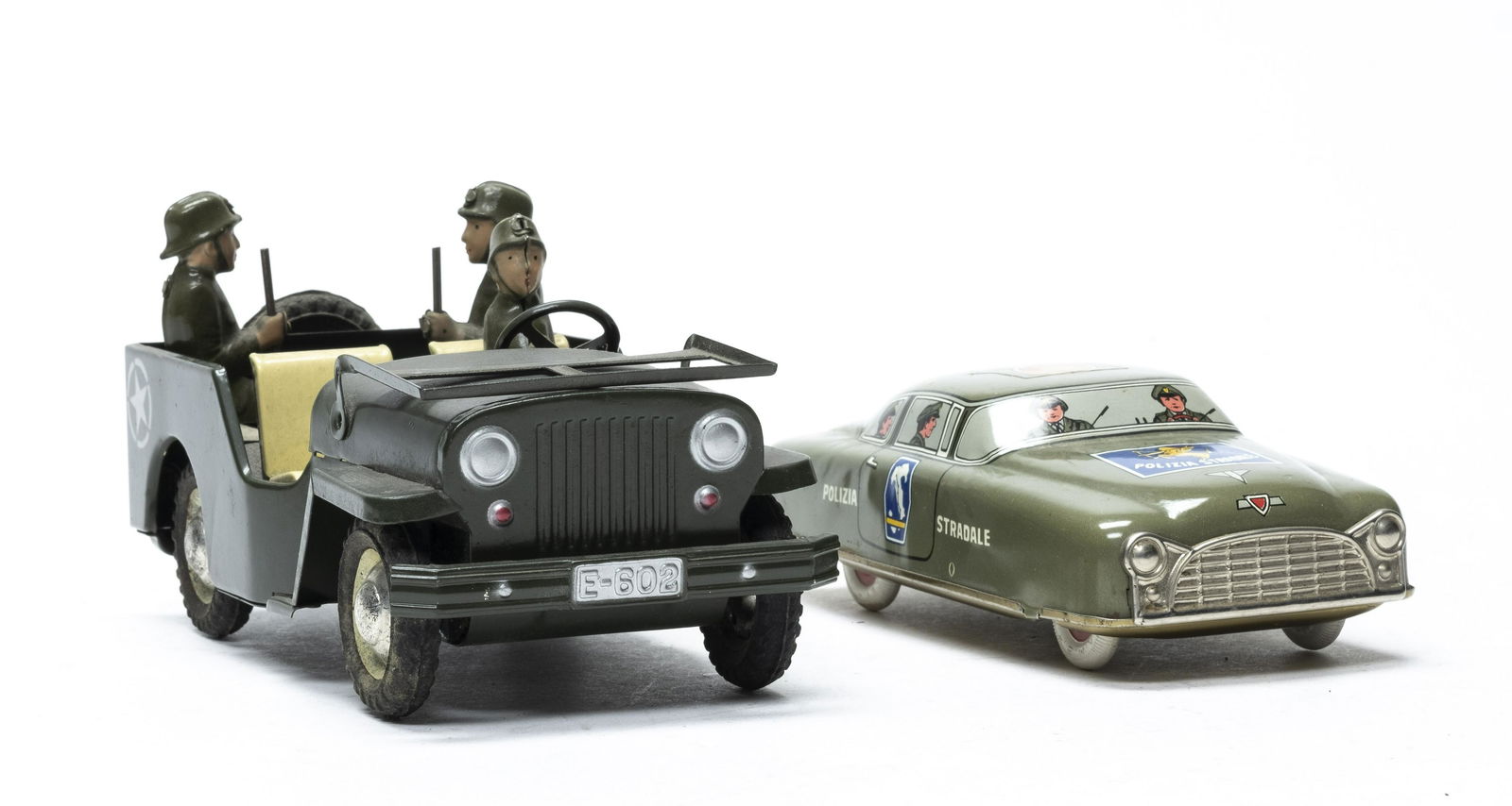Police Car / Army Jeep: Both Italian 1955 - 1960. 5 3/4" Long - 7" Long. One friction and one wind up. Worked when tested. Excellent Plus Condition. Retains a key.