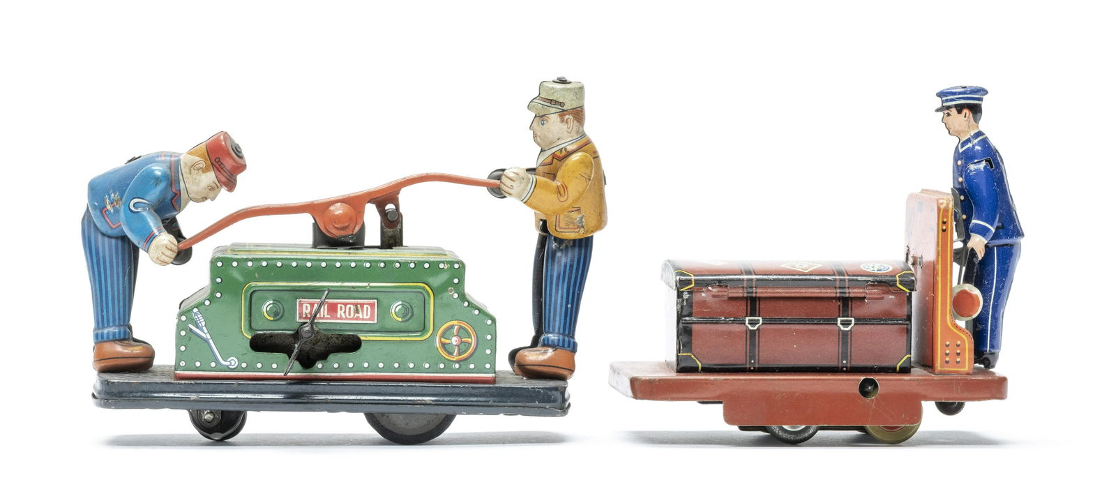 Hand Car and Railroad Porter: Japanese / German 1930's. The hand car is 5 1/4" Long a wind up made in Japan in the 1950's. The porter is very scarce 4 1/4" Long and made in Germany in the 1930's. Worked when tested. Excellent or B