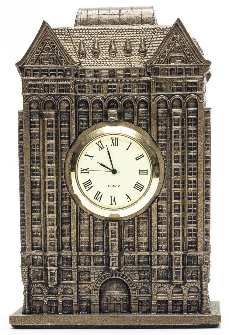 Skyscraper Clock: American - 1960's - 7.25" Tall. Not sure how this clock works as there is no keywind mechanism in plain sight. Pristine Condition.