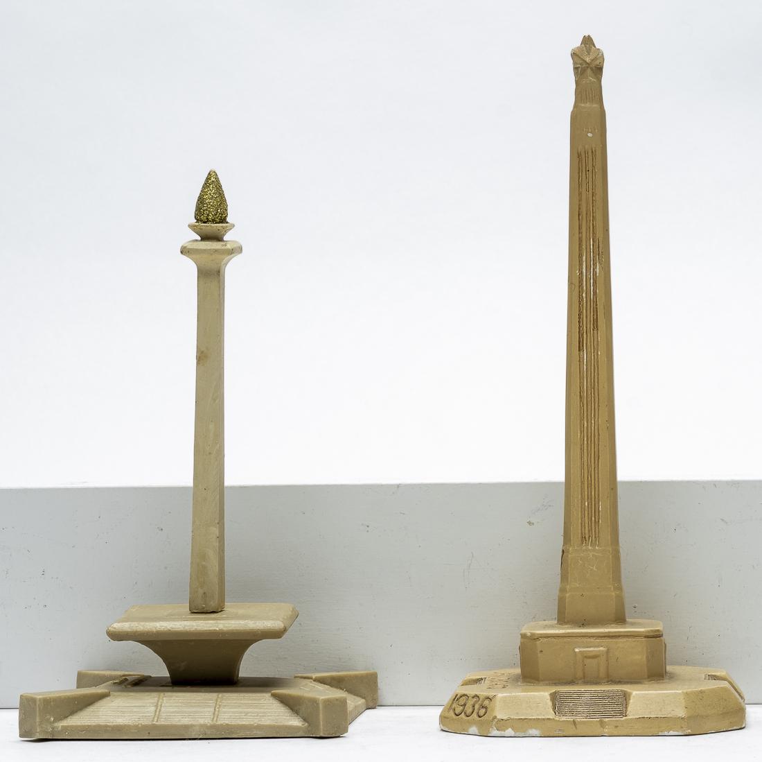 Two Obelisk Monument Souvenirs: American - 1940's to 1970's - 7" to 9" Tall. One for the Centennial Celebration of San Jacinto, Texas and one other. Excellent Condition.