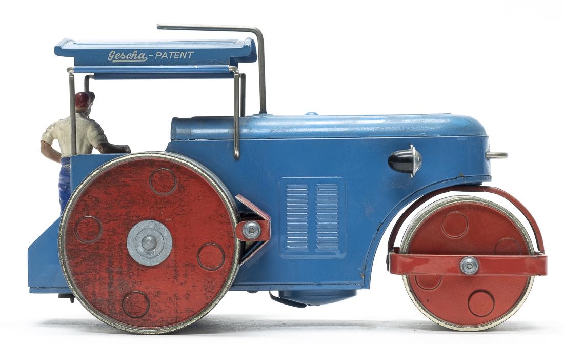 Gescha Road Roller: Gescha. German - 1950's 7 3/4" Long. This colorful toy requires a single battery to operate. It is either presently not working or we do not have the required type of battery to get it going. Pristine