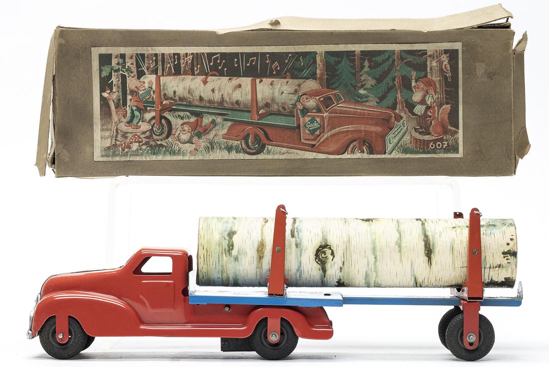 Gescha Log Truck with Box: Gescha. German - 1950's - 13.5" Long. It has good functioning friction action and plays music as it moves. Pristine Condition. Box torn.