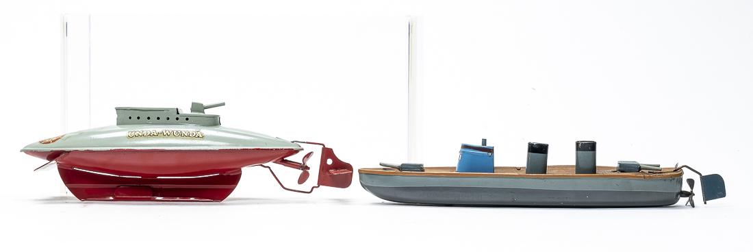 Submarine / Cruiser Toys: English/German - 1940's - 9" / 10" Long. The submarine by Sutcliffe is missing its sealing cork. The Cruiser is missing its mast. Both worked when tested. Very Fine Condition.