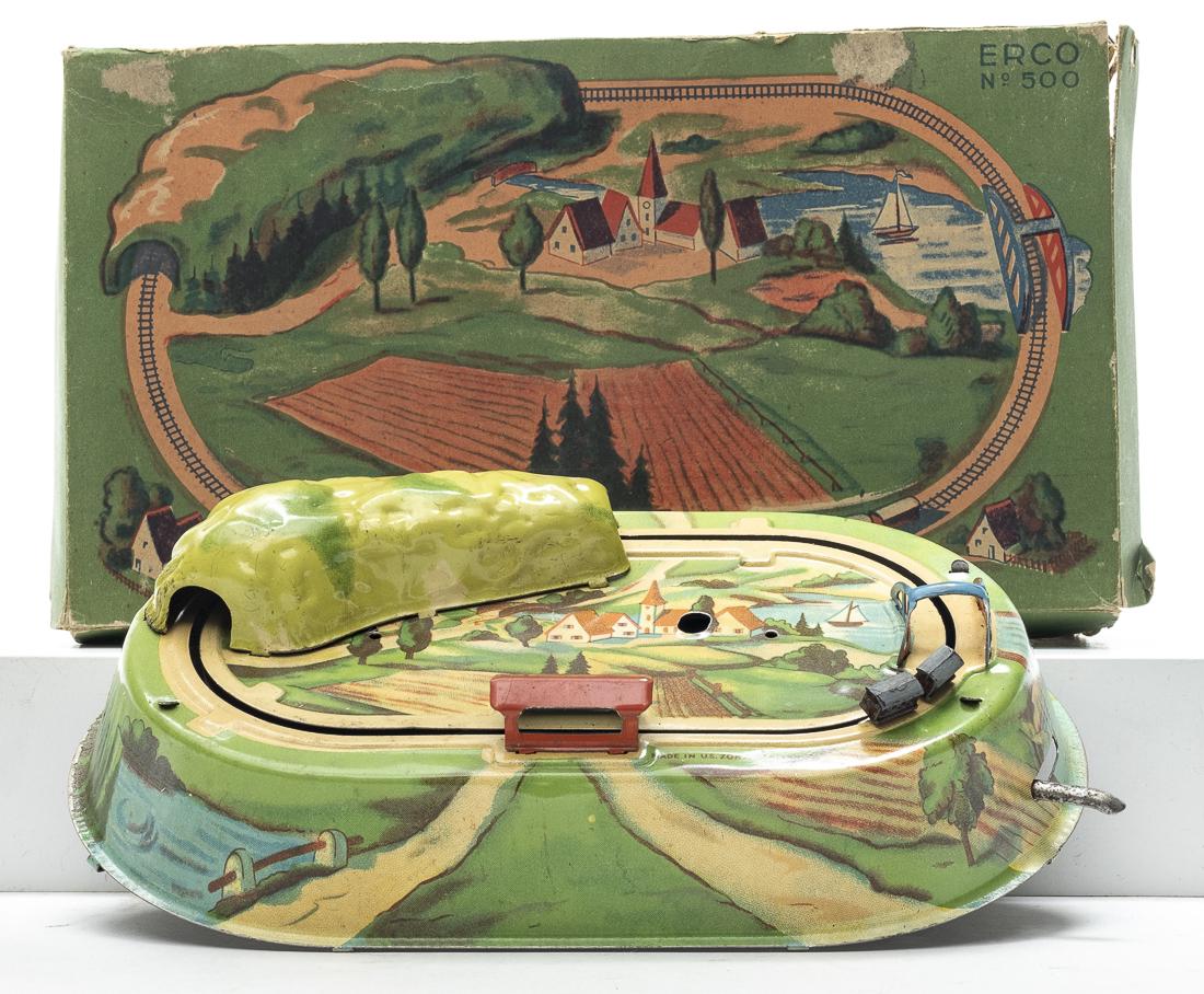 Train Go Round with Box: U. S. Zone German - 1950's - 8" Long. The toy in Pristine Condition, but the road that moves the train has loosened over time and must be tightened to make it work. Pristine Condition.