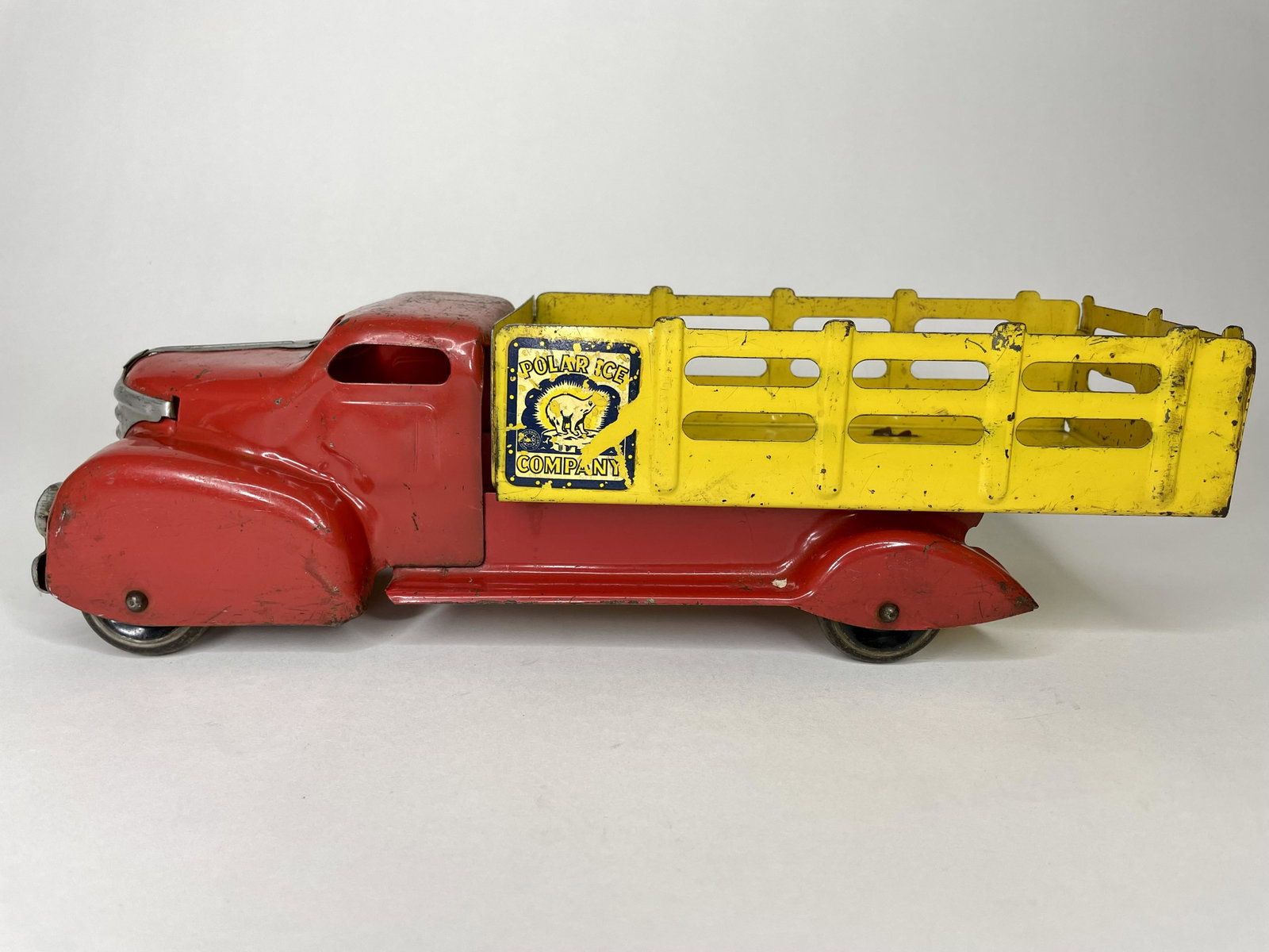 Polar Ice Company Delivery Truck: Made by Marx. Pressed Steel. 14 inches long. Very Good Condition; wear to roof.