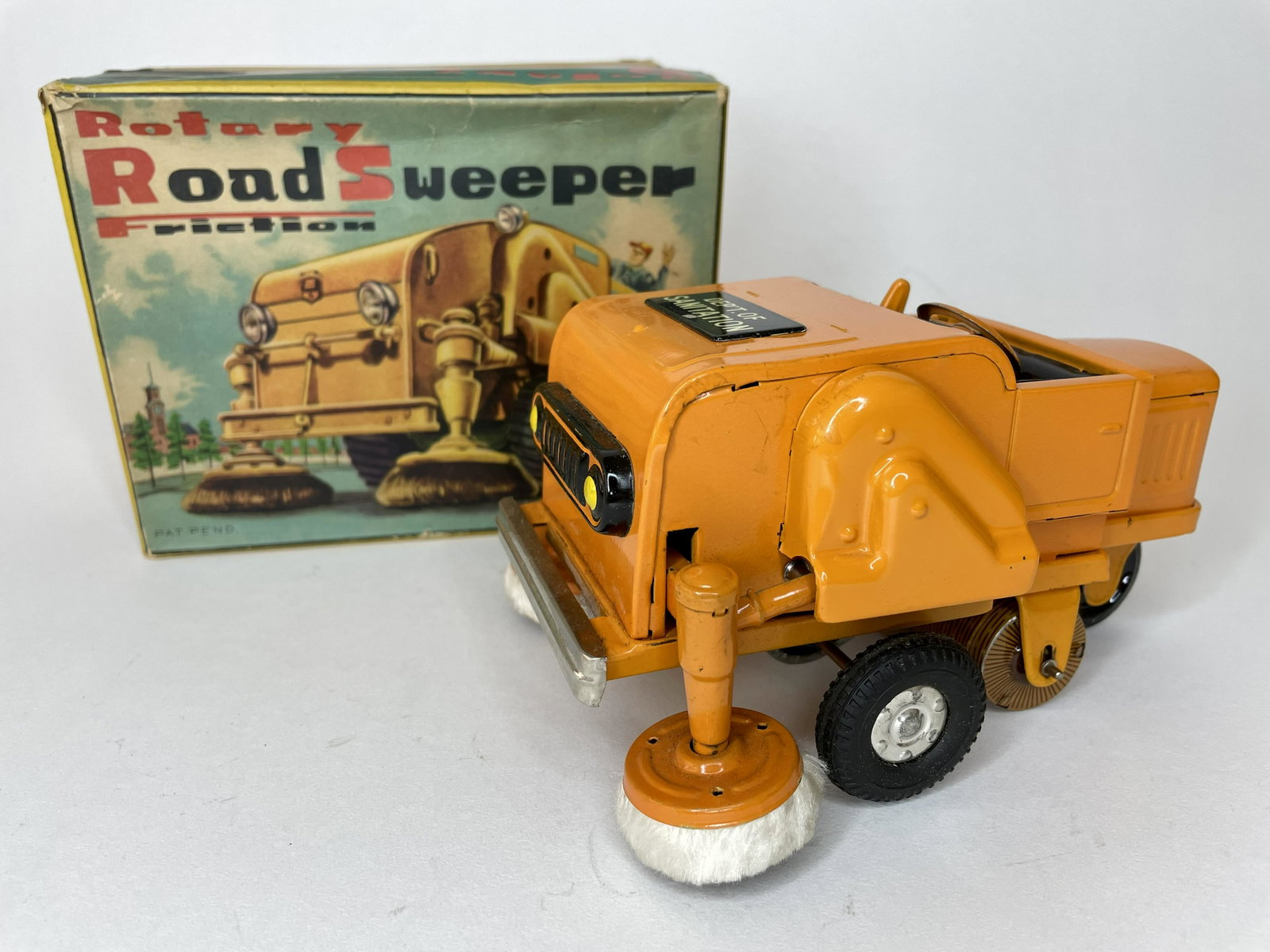 Yamaichi Rotary Road Sweeper Powered By Friction: Made by Yamaichi in Japan. Tin. 6 1/4 inches long. With original box. Pristine Condition.