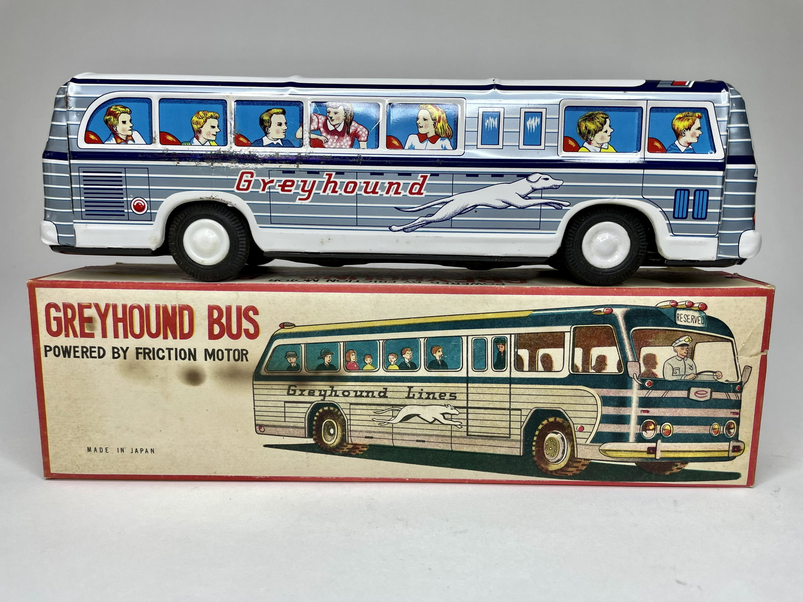 Greyhound Bus Powered by Friction: Made in Japan. Tin. 11 1/4 inches long. With original box. Excellent Condition.