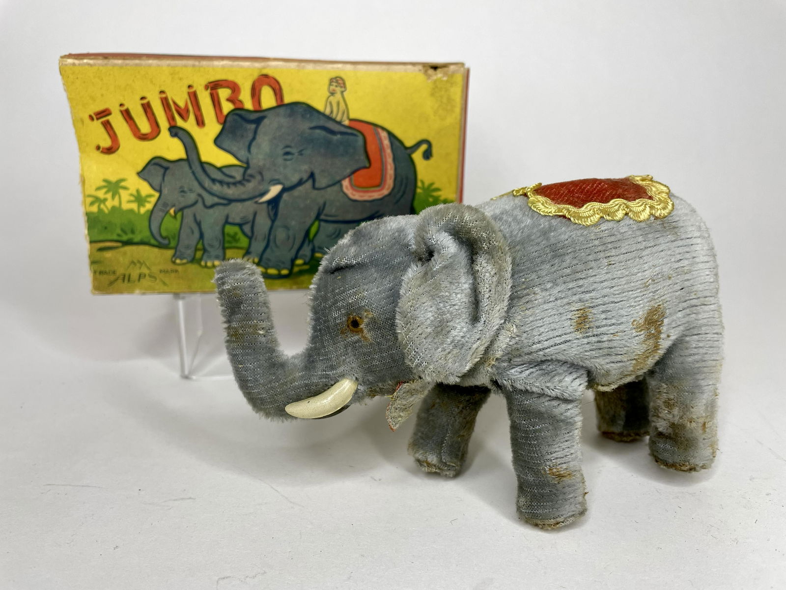 ALPS Jumbo the Elephant Wind-Up: Made by ALPS. 6 inches long. With original box. Very Good Condition; Box end flap detached.