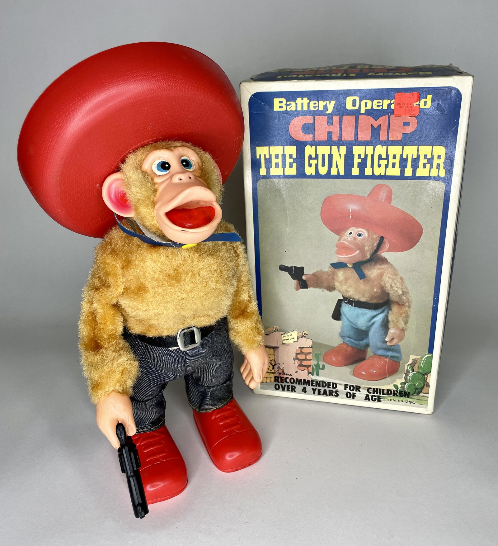 Chimp the Gun Fighter Battery Operated: Made in Japan by Amico Toy. With original box. In working order. Excellent Condition.