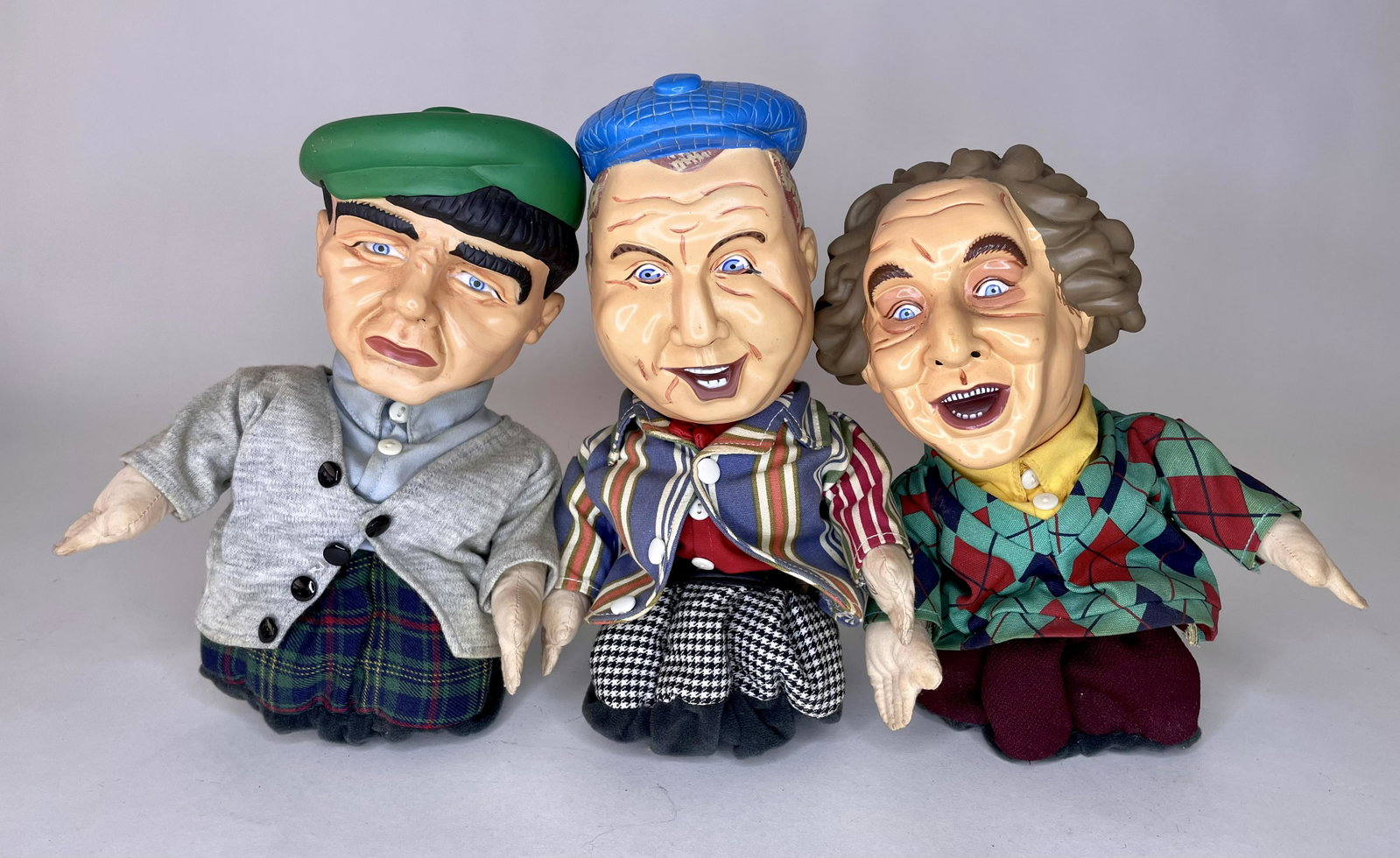 The Three Stooges Vocal Puppets: Larry, Curly and Moe. Measuring 10 inches high. Excellent Condition.