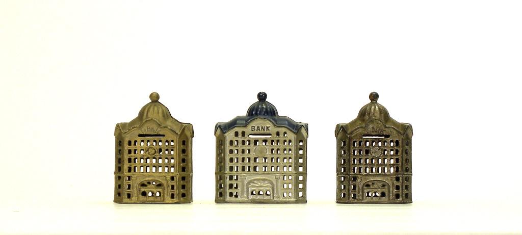 Three Domed Iron Banks: A. C. Williams. Ravenna, Ohio - 1920's. 4.625" to 4.875" Tall. Two appear to be very old, good looking repaints. Fine Condition.