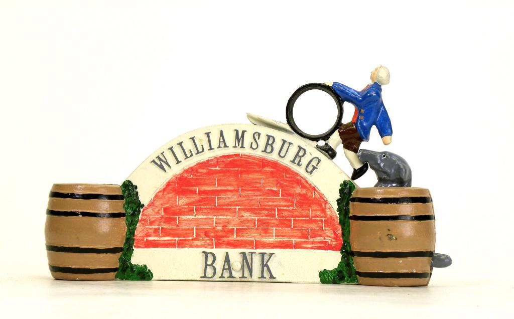 Williamsburg Bank: Reynolds Toys - Dated 1991. Made for the MBCA's 1991 Convention held in Williamsburg, VA and hosted by Charlie & Judy Reynolds. Place a coin on his tray and depress the lever; the momentum deposits th