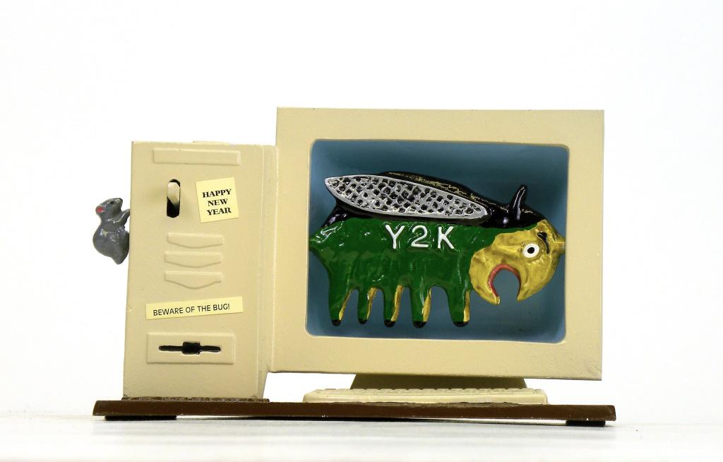 De Bug Bank: Reynolds Toys - 1999. Made for the approach of the turning of the millennial and the feared Y2K computer bug. Place a coin in the slot atop the bank, depress the mouse activation lever, the bug flips 
