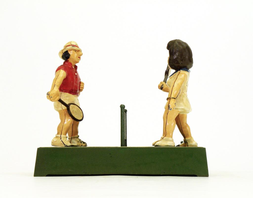 The Tennis Bank: John Wright Company. Pennsylvania - 1975. This bank is a depiction of the famed grudge match between Billie Jean King and Bobby Riggs that took place September 20, 1973. Billy Jean King slaughtered hi