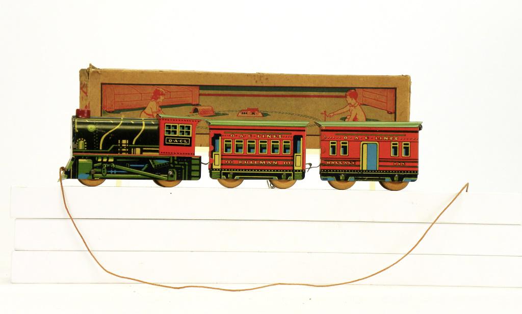 Pullman Train with Box: American - 1930 - 12.5" Long. This pull train marked O. A. C. L. is in Near Mint Condition with the original Box.