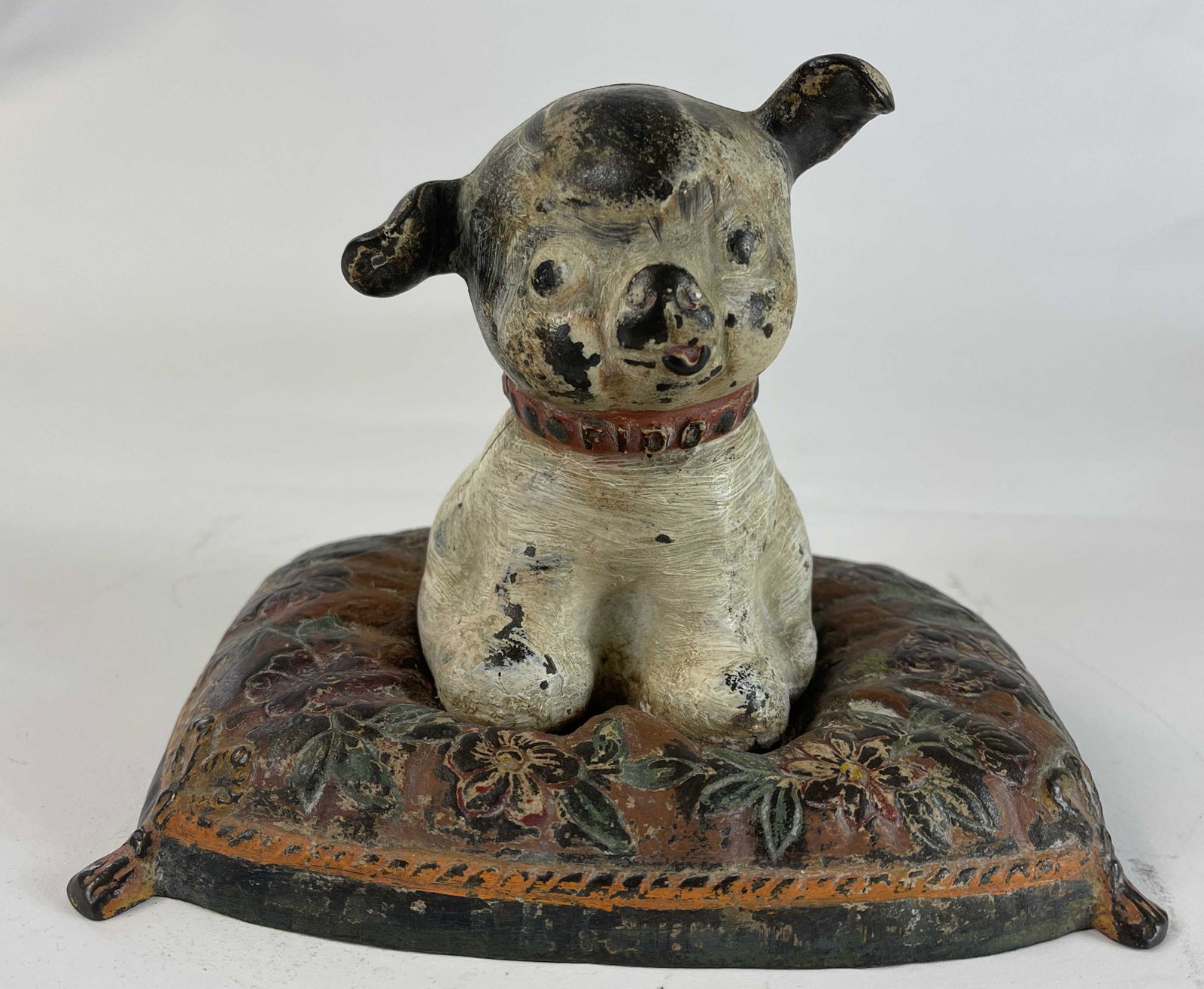 Fido on Pillow Iron Bank: Hubley Mfg. Co. Lancaster, Pennsylvania - 1930's. An old repaint.