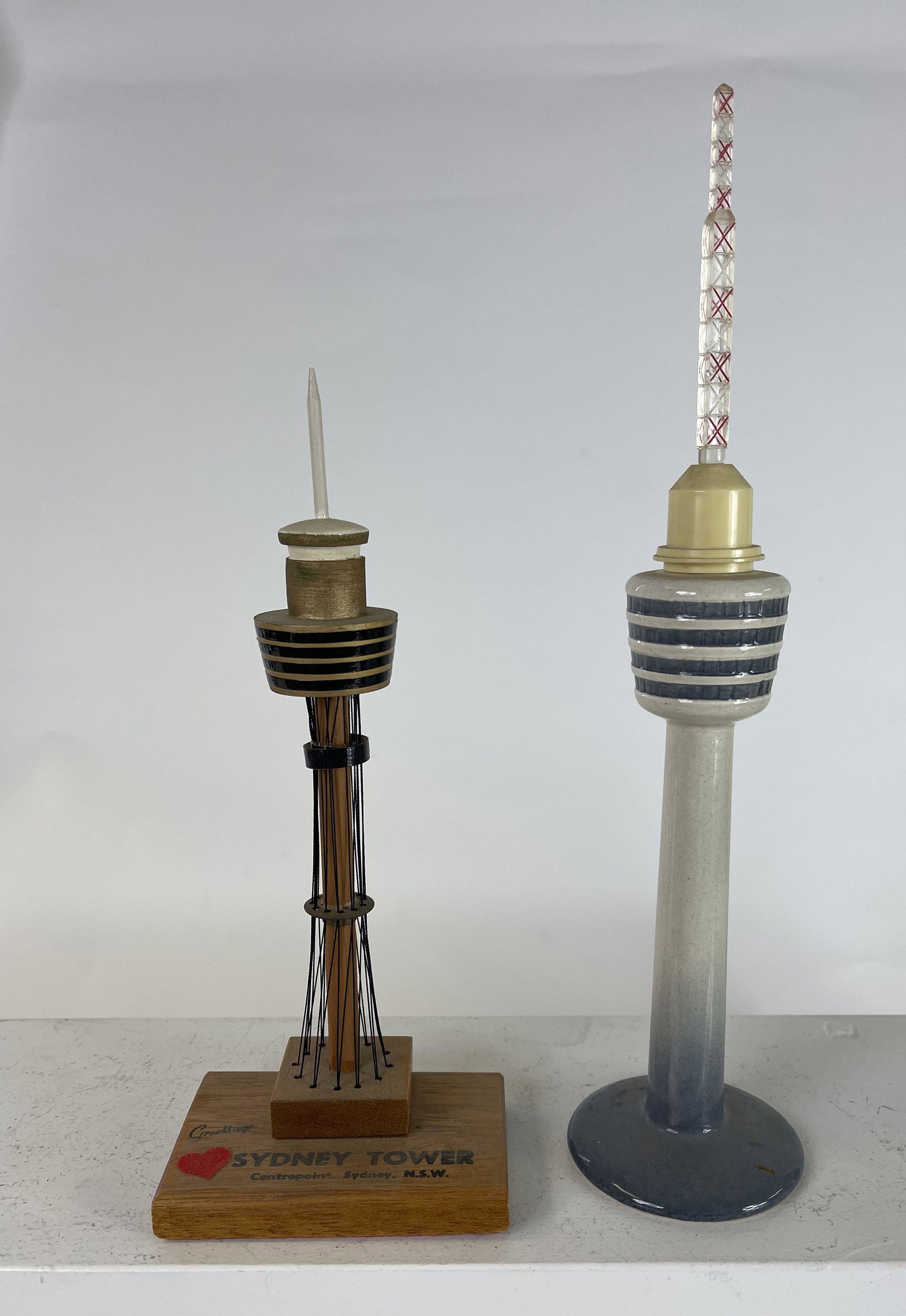 Two Sydney Australia Towers: 1960's to 1970's - 8" to 11" Tall. One made of wood and the other ceramic. Very Fine Condition.