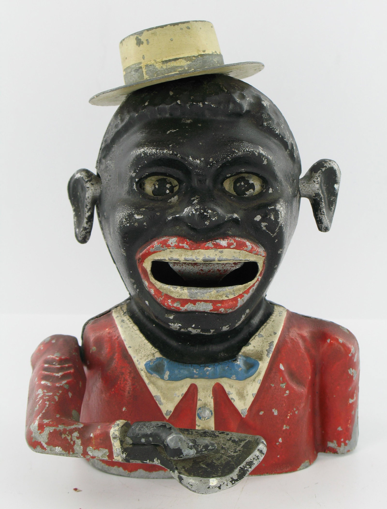 Jolly Man Sonny Boy with Hat Mechanical Bank: Made by Robert Starkies, Aluminum. Circa 1945. Eyes move down, chevrons on arm and lattice base. "Patent 601362" embossed inside the back piece. Lattice embossed "Starkies Patent 32587 and Registered 